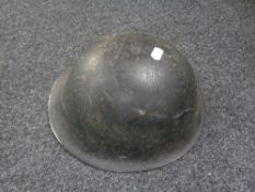 A twentieth century tin helmet