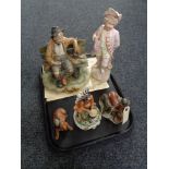 A tray of bisque figure - boy with violin together with two Capo di Monte figures and two further