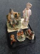 A tray of bisque figure - boy with violin together with two Capo di Monte figures and two further