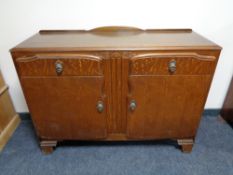 A mid 20th century oak sideboard