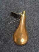 An antique copper and brass black powder flask