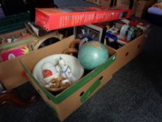 Two boxes of tins, globe, boxed easel,