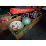 Two boxes of tins, globe, boxed easel,