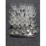 A tray of glass, etched glass beaker,