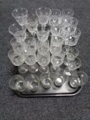 A tray of glass, etched glass beaker,