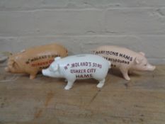 Three metal pig money boxes