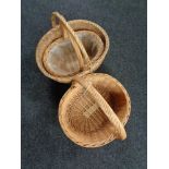 Three wicker hand baskets