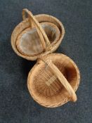 Three wicker hand baskets