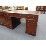 A Victorian twin pedestal writing desk with nine drawers