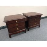 A pair of Stag Minstrel two drawer bedside tables