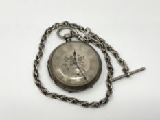 A heavy silver pocket watch with silver dial and Albert chain CONDITION REPORT: