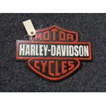 A metal Harley Davidson plaque