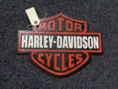 A metal Harley Davidson plaque