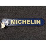 A metal Michelin plaque