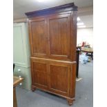 A 19th century oak four door corner cabinet