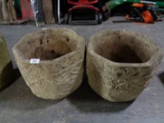 A pair of concrete octagonal planters