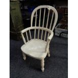 An antique painted child's Windsor armchair