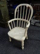 An antique painted child's Windsor armchair