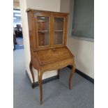 A French inlaid rosewood bureau bookcase with gilt metal mounts