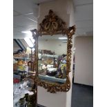 A decorative gilt framed mirror