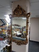 A decorative gilt framed mirror