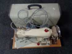 A cased mid century Jones sewing machine