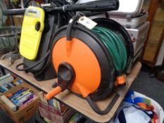 A hose on reel with attachments