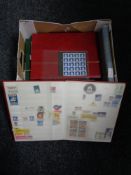 A box of eight stamp albums of the world