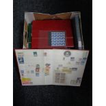 A box of eight stamp albums of the world