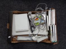 A box of Nintendo Wii accessories and games