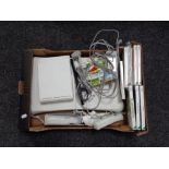 A box of Nintendo Wii accessories and games