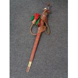 A Sudanese Kaskara style sword in leather scabbard with rope strap