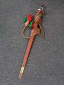 A Sudanese Kaskara style sword in leather scabbard with rope strap