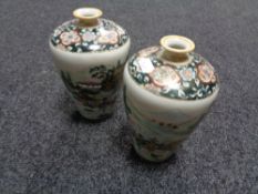 A pair of Noritake vases depicting Geisha, height 20 cm.