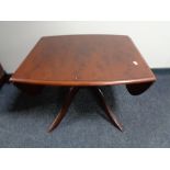 A Stag Minstrel flap sided pedestal coffee table