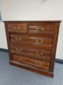 An Edwardian five drawer chest with brass drop handles