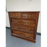 An Edwardian five drawer chest with brass drop handles