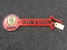 A metal Ferrari workshop plaque