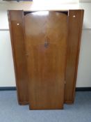 A 20th century single door oak wardrobe