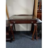 A stained beech wood hall table on claw and ball feet