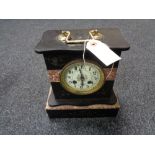 A Victorian black slate and marble mantel clock with brass and enamelled dial
