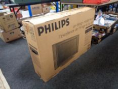 A boxed Philips 32 inch lcd tv