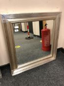 A silvered framed mirror