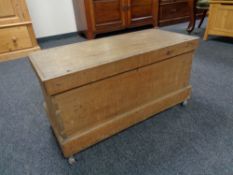 An antique pine blanket box