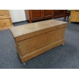 An antique pine blanket box