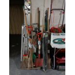 Six bundles of assorted garden tools and a set of drain rods