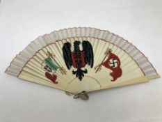 A fan with painted German eagle and swastika