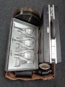 A box of Antler brief case, binoculars,