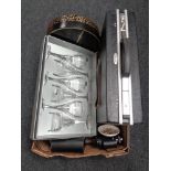 A box of Antler brief case, binoculars,