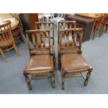 A set of four 20th century oak dining chairs